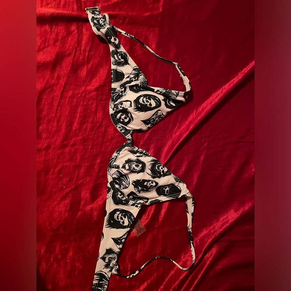 Bikini top purple with grim reaper pattern. Zumes Broken Promises size L.